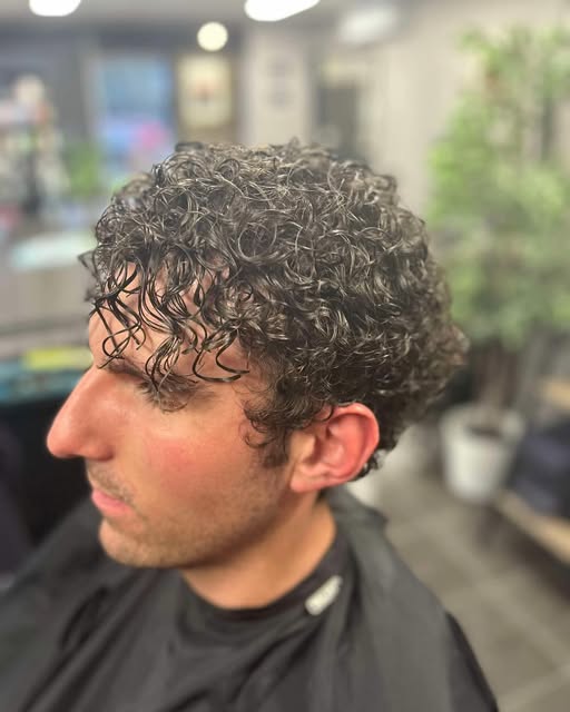 A men&rsquo;s perm with tight curls
